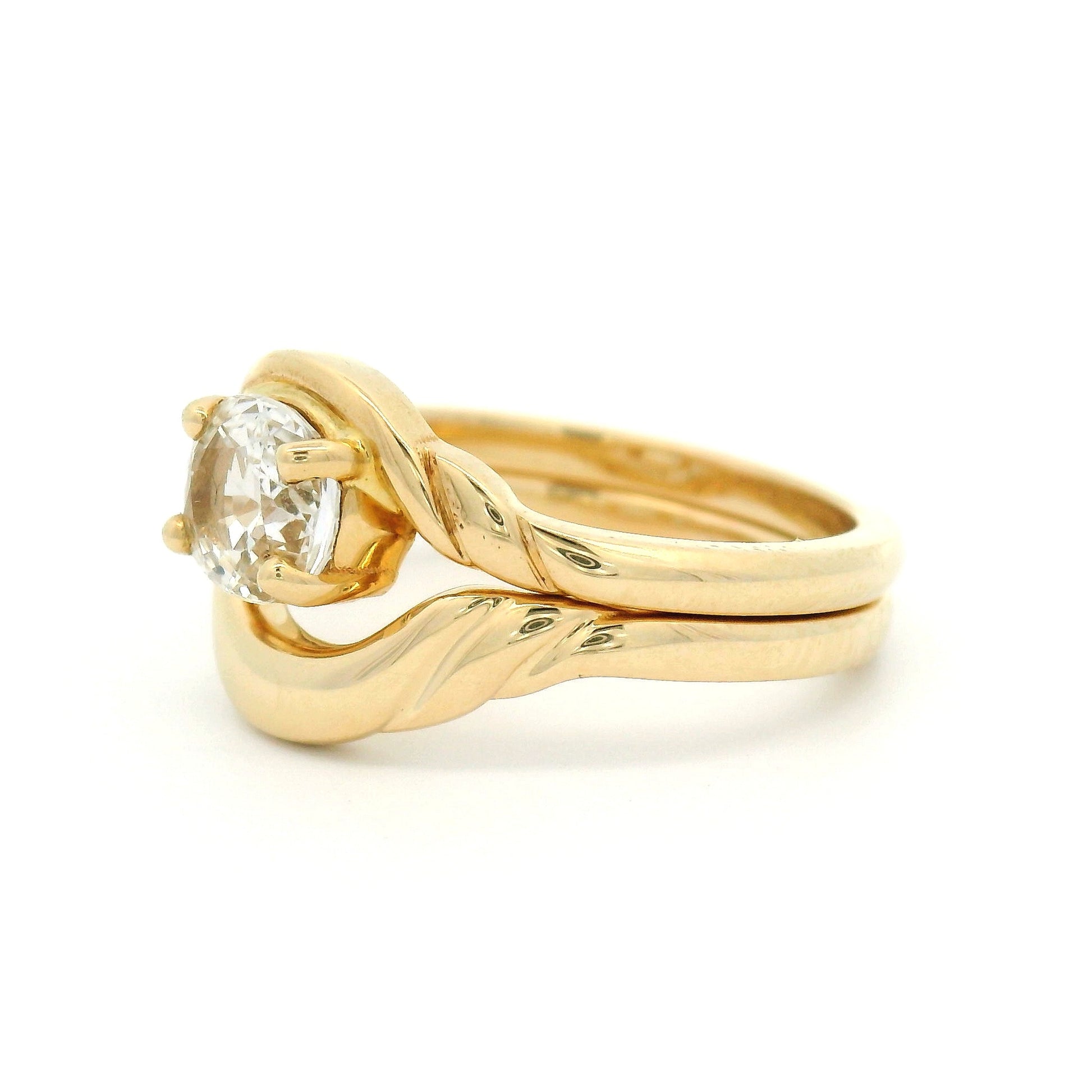 14k Yellow Contoured Sculpted Wedding Band shown paired with a white sapphire solitaire.