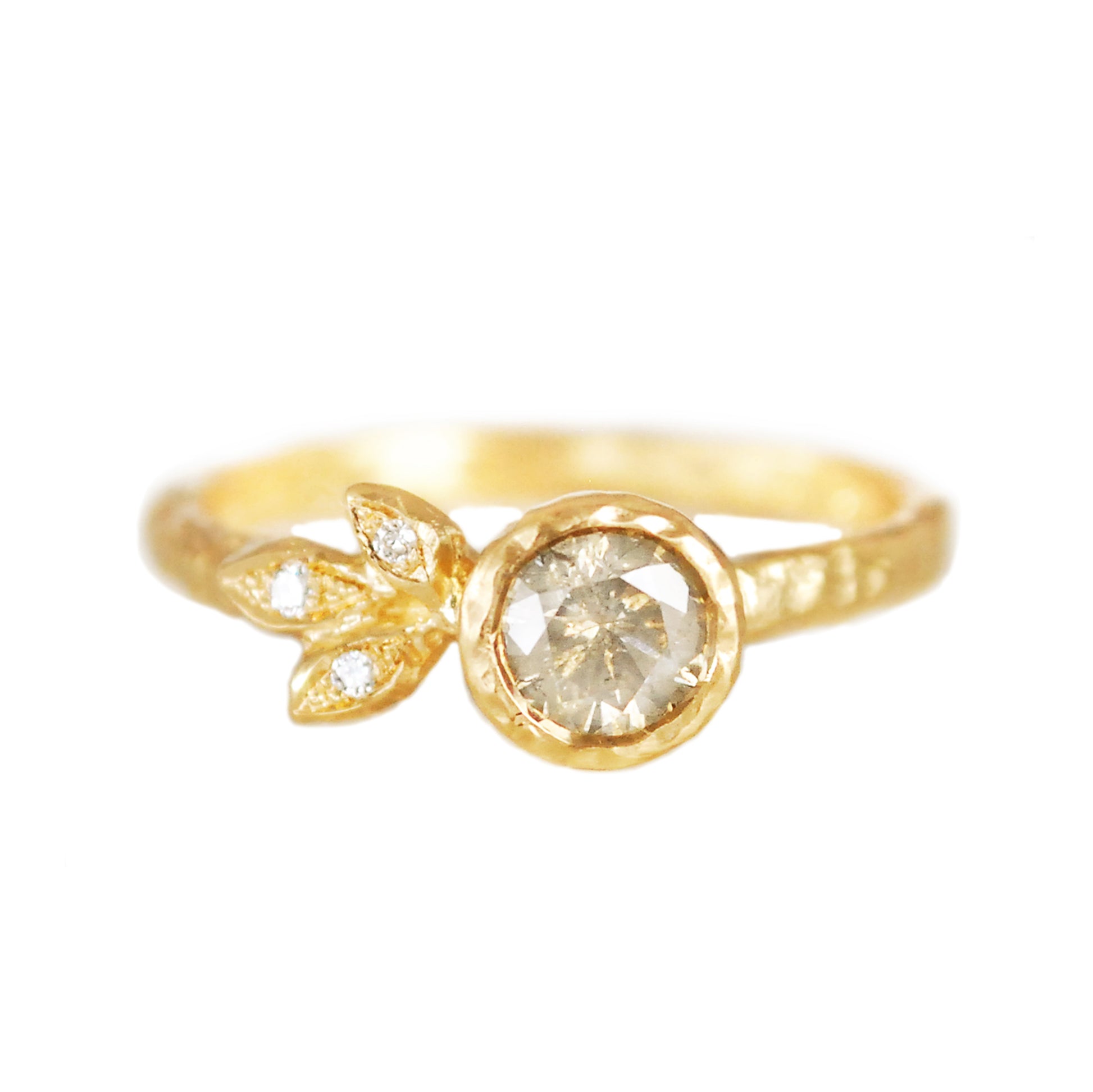 14K yellow gold organic engagement ring featuring a bezel-set 0.51ct icy grey round brilliant diamond and three natural diamond accents set in sculpted leaves.