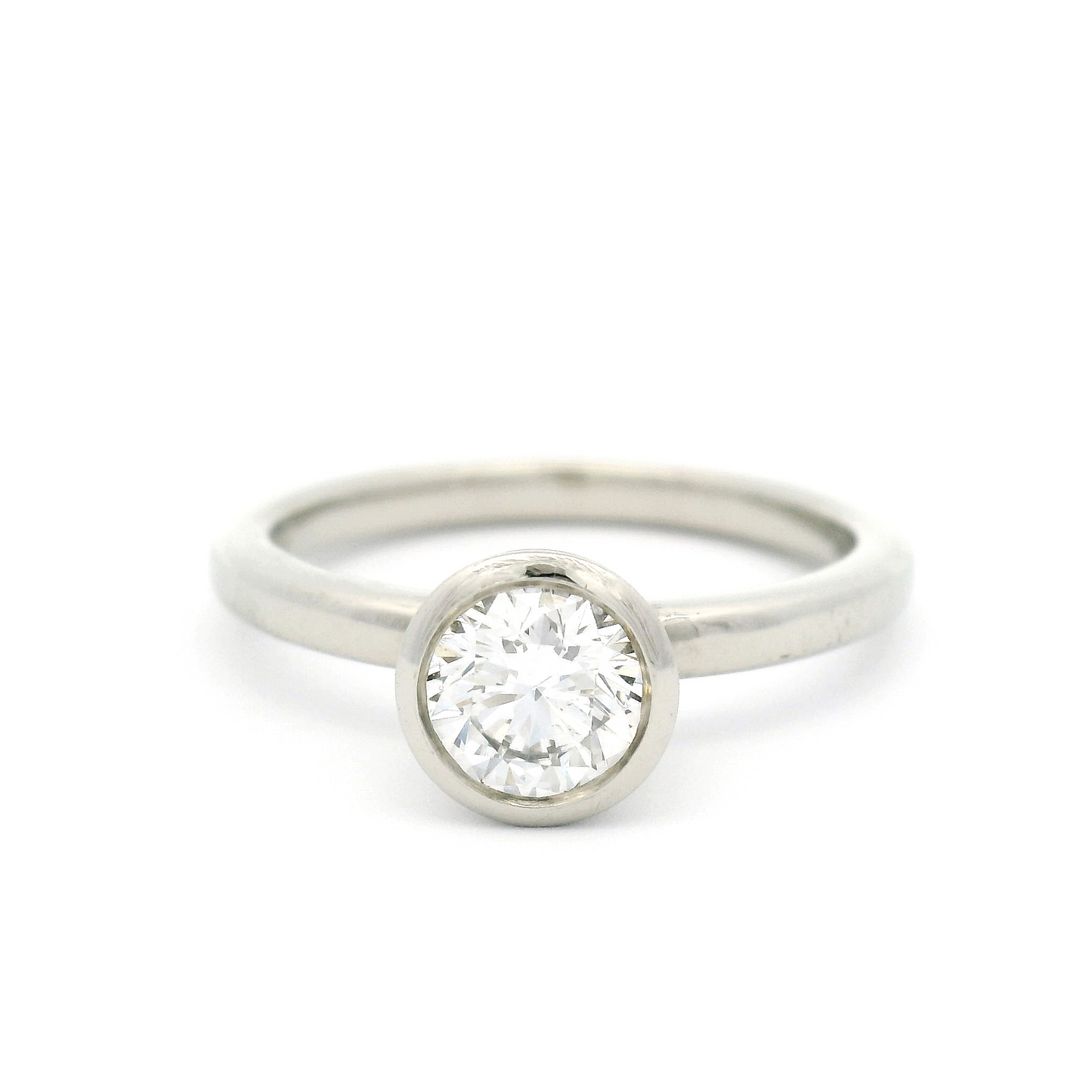 14k White Bezel Set Solitaire with 0.64ct Diamond