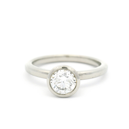 14k White Bezel Set Solitaire with 0.64ct Diamond