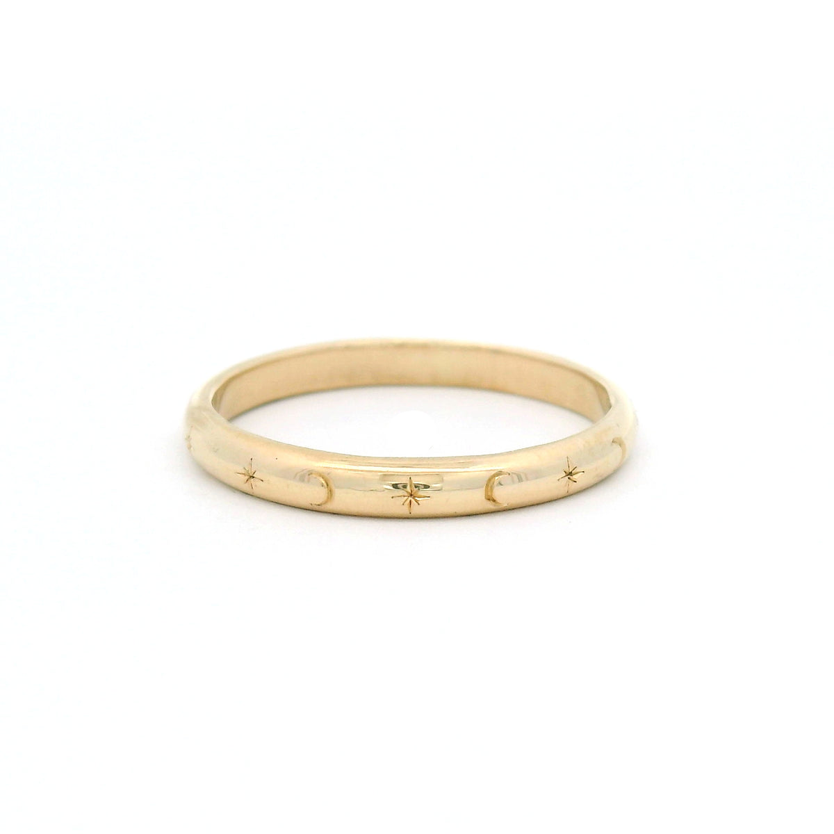 10K yellow gold 2.5mm soft dome band hand-engraved with alternating star and crescent moon motifs.