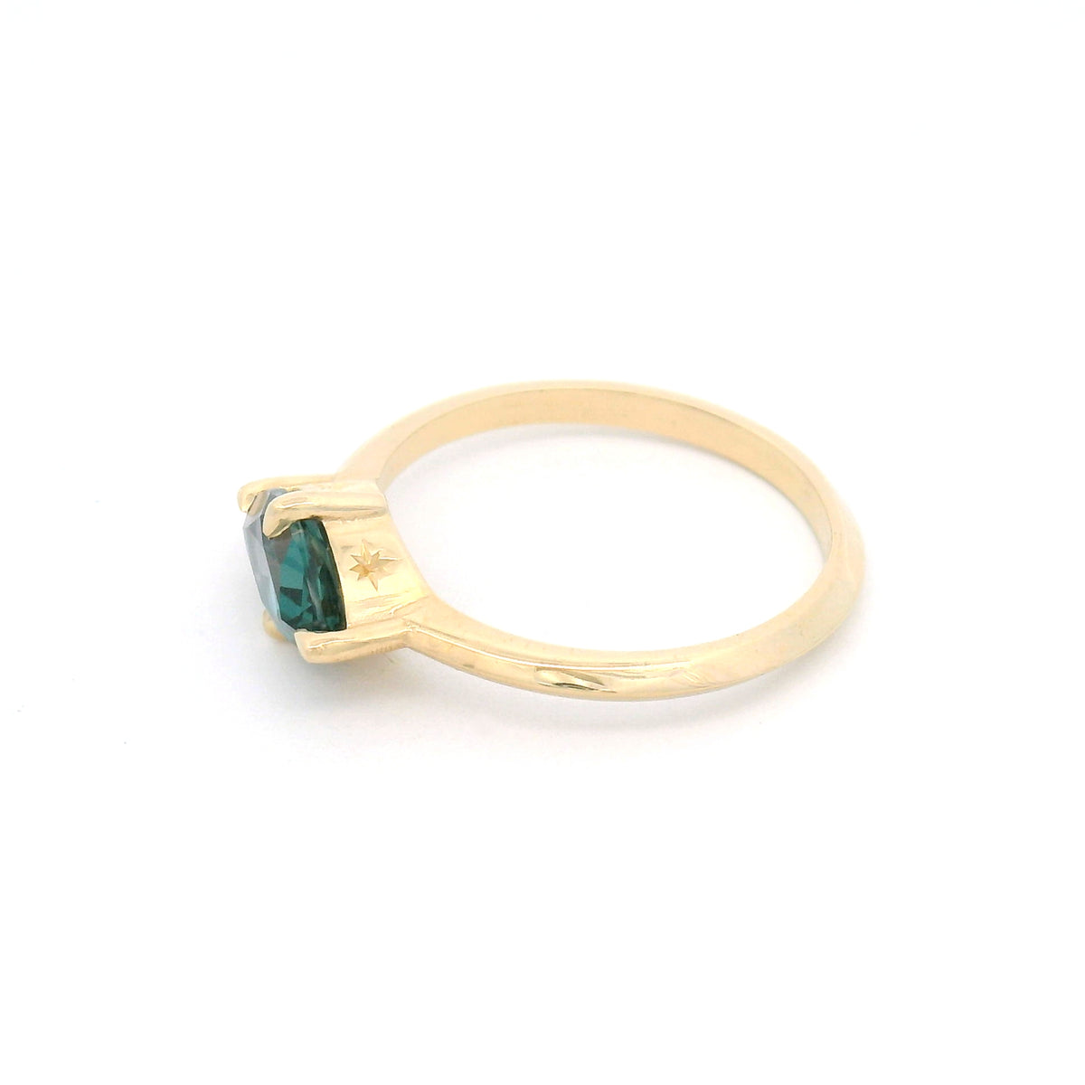10K yellow gold solitaire engagement ring with a claw-set 1.00ct lab-grown alexandrite, 1.8mm knife-edge band and engraved star undergallery.