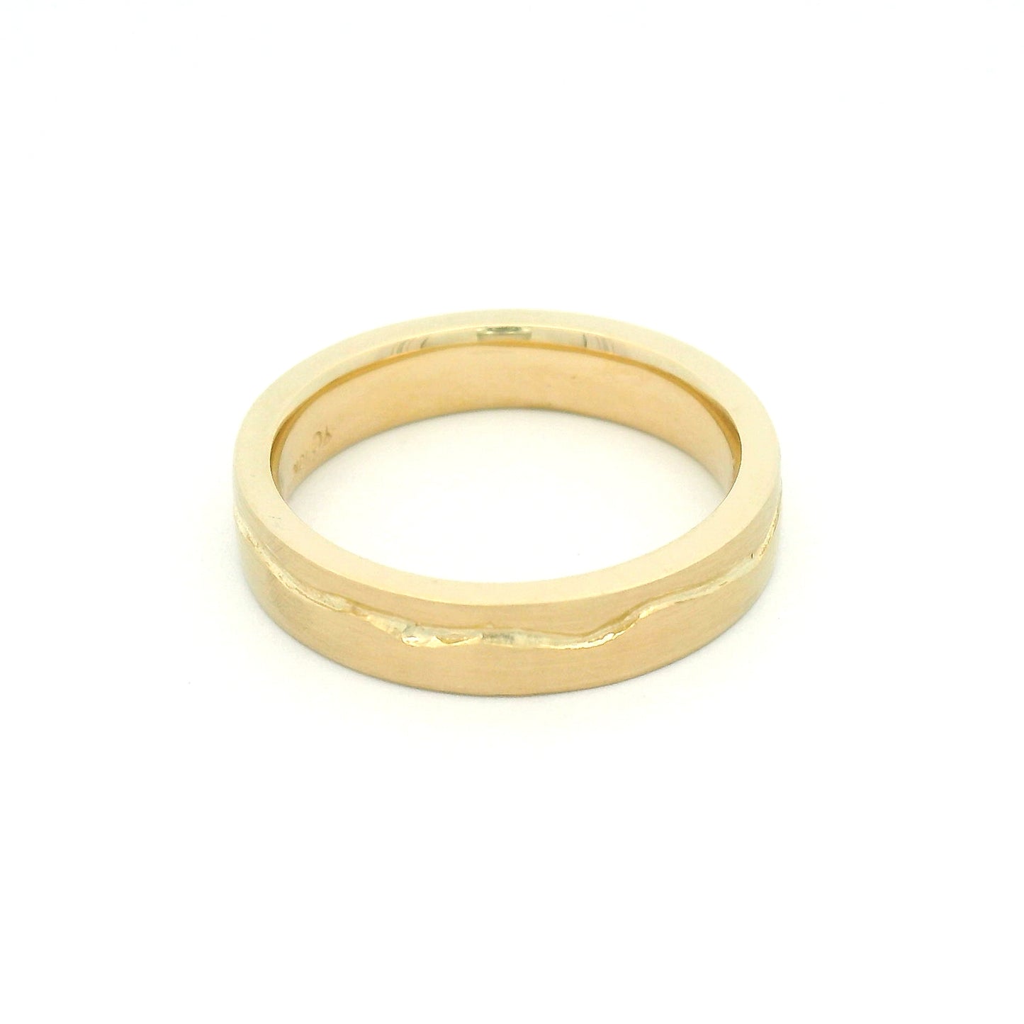 10K yellow gold 4mm wedding band with a soft flat profile, satin finish, comfort-fit interior, and delicate wandering cut path wrapping the band.