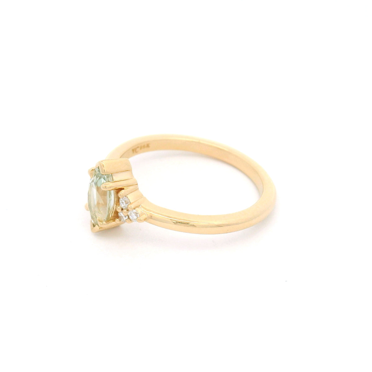 14K yellow gold claw-set engagement ring with a 0.83ct marquise light-green sapphire and six round brilliant-cut lab-grown diamond accents.