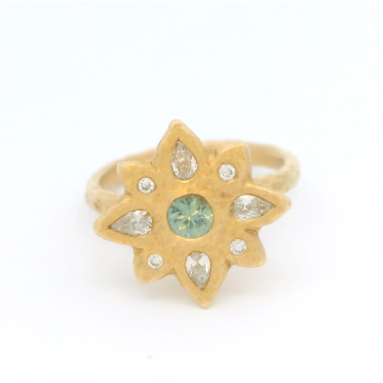 14k yellow organic ring set with a teal blue sapphire and diamond accents