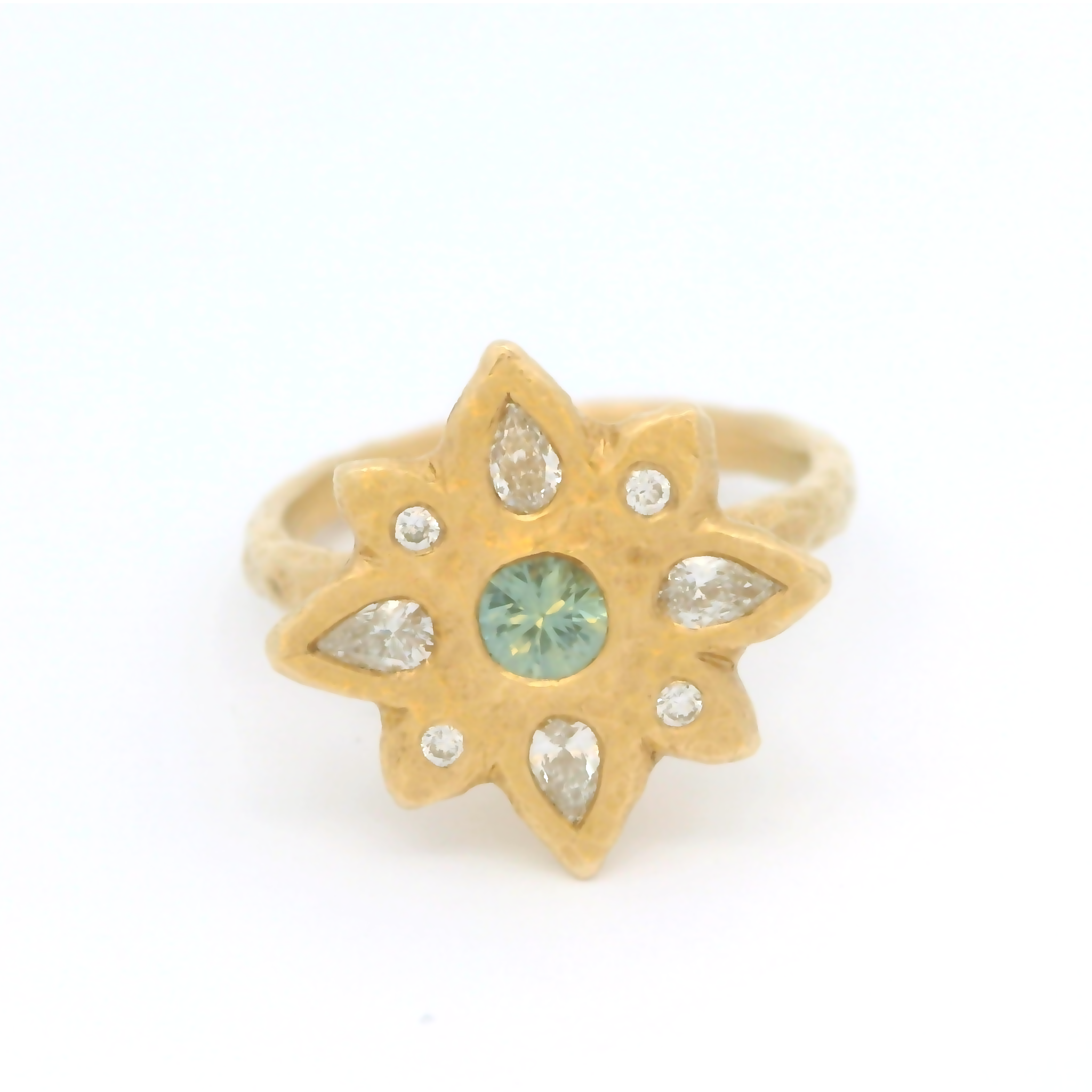 14k yellow organic ring set with a teal blue sapphire and diamond accents