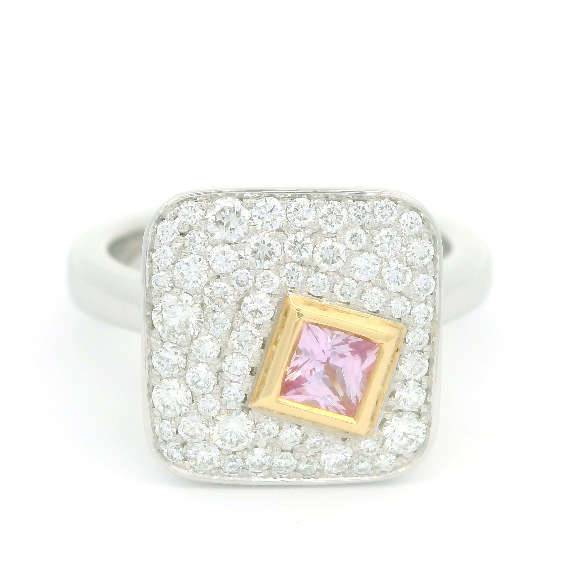 Plat and 18k yellow ring with bezel set 0.25ct pink princess cut sapphire surrounded by pave set diamonds.